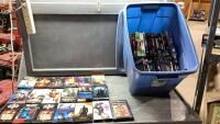 BLUE TOTE WITH VHS MOVIES