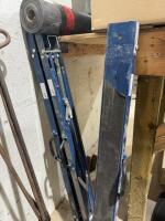 Three folding sawhorses