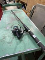 Quantum open face reel mounted on hunter rod