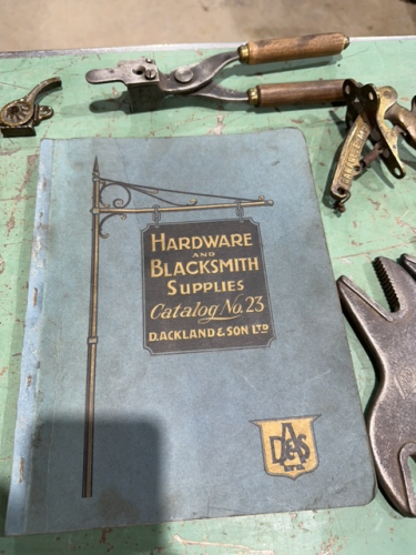 Blacksmith clenching tools, antique sets, knives punches, and a 1928 hardware and blacksmith supply catalogue number 23