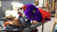 BLACK BAG WITH STUFFIES AND DRESS UP COWBOY HATS