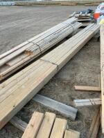 Bundle of treated 16 foot X 4 x 4