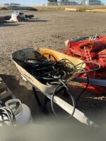 Wheel barrel of Tiger, torches and hoses