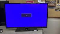 42" FLUID FLAT SCREEN TV ON STAND - NO REMOTE