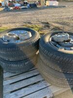 Set a four Ford tires on rims