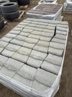 Pallet of gray retaining wall concrete blocks