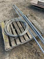 Pallet of three-quarter inch plastic conduit, and roll of aluminum wire
