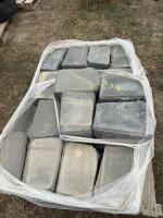 Pallet of black retaining wall concrete blocks