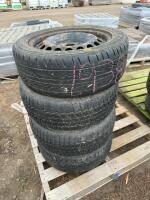 Stack of four car tires