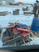 Pallet of shovels and brooms