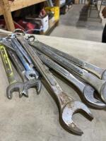Leather pouch, full of wrenches
