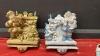 (2) HEAVY RESIN STOCKING HOLDERS W/ CAST BASES AND LIGHTED SNOW VILLAGE - 3