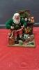 KIRKLAND FABRIC MACHE SANTA BY FIREPLACE