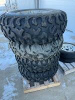 STACK OF (4) ATV TIRES ON 4 BOLT RIMS