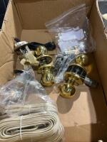 Box of mixed door, knobs locks, and telephone wire