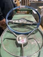 Two antique steering wheels