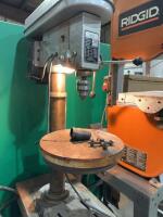Drill press on wooden stand