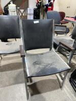 Stack of four chrome and vinyl chairs