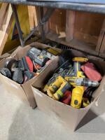 Two boxes of cordless drills, chargers, batteries, and miscellaneous parts