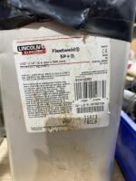 Three cans of Lincoln welding rod