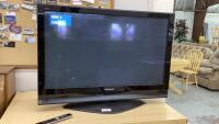 PANASONIC 42" PLASMA FLAT SCREEN TV ON STAND , WITH REMOTE