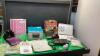 BOX W/ CD CLOCK RADIO (LOOKS NEW), PUZZLE BOOKS, NOTEBOOKS, BINOCULARS