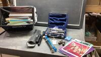 BIN WITH CLARINET AND ASSORTED MUSIC BOOKS