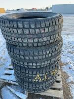 Stack of four Cooper tires