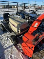 White lawn tractor with Erin&rsquo;s snowblower