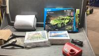 BOX WITH ASSORTED ITEMS - PUZZLES, REMOTE CONTROL CAR, MILWAUKEE M12 CHARGER, FLAT SCREEN TV LEGS, LIGHT WEIGHT BLANKET