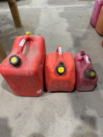 Three assorted poly Jerry cans