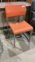 (2) PLASTIC ORANGE STACKING CHAIRS