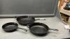 (3) CAST IRON PANS - WOODS , LAGASTINA AND SMALL ONE IS UNMARKED