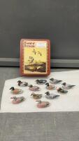 (12) MINI HAND CARVED WOOD DUCKS IN FIELD & STREAMS TIN BOX