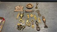 COLLECTION OF VINTAGE BRASS ITEMS - BOTTLE OPENERS, BUTTONS, CRUMB TRAYS, ASHTRAY, COW BELL