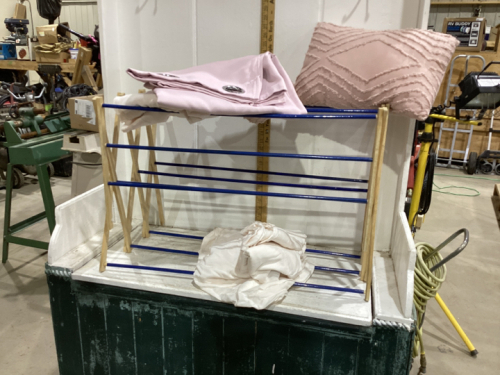 DRYING RACK. PINK PILLOWS