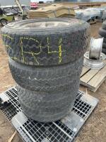Set of four tires mounted on Ford rims