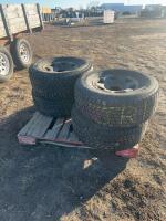 Stack of four tires on 6 bolt steel rims