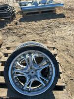 Two car tires on rims