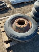 Single 22.5 unused tire on steel rim