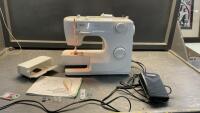 SINGER SEWING MACHINE W/ MANUAL AND SOME ACCESSORIES