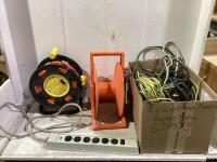 SHOP BOX W/ EMPTY REEL, EXTENSION CORD REEL, WIRES, EXTENSION CORDS, POWER STRIPS & MISC