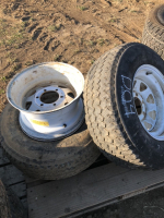 (4) 15 inch six bolt trailer rims 2 with tires