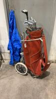 ORANGE COOPER VINYL GOLF BAG W/ (9) SPALDING CLUBS ON A FOLDING CART