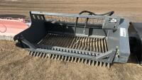 Skid steer front mount hydraulic rock picker