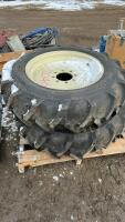 2 TIRES , 1 MOUNTED ON STEEL RIM , 1 WITHOUT RIM W/ TUBE