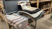STACK OF ASSORTED SADDLE PADS