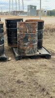 Pallet of three steel barrels