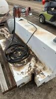 L shaped fuel tank with pump