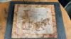 INUIT CARVED ART ON A PIECE OF MARBLE/GRANITE